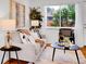 Comfortable living room with hardwood floors, a plush gray sofa, and decorative accents at 4201 Shoshone St, Denver, CO 80211