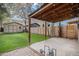 Cozy backyard patio with string lights, artificial grass, and storage shed in a charming outdoor setting at 1020 Kalamath St, Denver, CO 80204