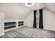 Attic bedroom with carpet, built in shelves, storage and good natural light at 1020 Kalamath St, Denver, CO 80204