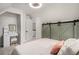 The bedroom boasts charming sliding barn doors, a vanity and great natural light at 1020 Kalamath St, Denver, CO 80204