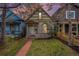Charming home exterior with well-maintained landscaping, sidewalk and a stone foundation at 1020 Kalamath St, Denver, CO 80204