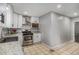 Galley style kitchen featuring stainless steel appliances, white cabinets and sleek counter tops at 1020 Kalamath St, Denver, CO 80204