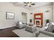 The living room showcases a fireplace, a gray sofa and chairs, and dark hardwood floors at 1020 Kalamath St, Denver, CO 80204