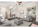 Bright living room features hardwood floors, stairs, ceiling fan and a seamless transition to the dining area at 1020 Kalamath St, Denver, CO 80204