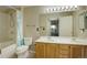 Bright bathroom featuring double sinks, bathtub with shower, and updated fixtures at 1016 Opal St # 102, Broomfield, CO 80020