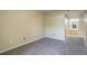 Carpeted bedroom showcasing the view to a well lit bathroom at 1016 Opal St # 102, Broomfield, CO 80020