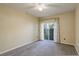 Bedroom with large windows providing natural light and private outdoor access at 1016 Opal St # 102, Broomfield, CO 80020