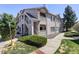 Multi-level condo building featuring maintained landscaping, private entrances, and a welcoming community feel at 1016 Opal St # 102, Broomfield, CO 80020