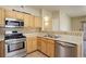 Close up of kitchen area with stainless steel appliances, and decorative backsplash at 1016 Opal St # 102, Broomfield, CO 80020