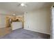 Open-concept living room showcasing kitchen with stainless steel appliances and ample counter space at 1016 Opal St # 102, Broomfield, CO 80020