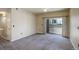 Spacious living room with sliding glass doors leading to outdoor patio at 1016 Opal St # 102, Broomfield, CO 80020