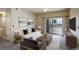 Well-appointed living room featuring stylish furnishings and access to an outdoor patio at 1016 Opal St # 102, Broomfield, CO 80020