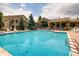 Inviting community pool area with lounge chairs, perfect for relaxation and outdoor enjoyment at 1016 Opal St # 102, Broomfield, CO 80020