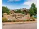 Miramonte Ranch community entrance sign with manicured landscaping and stone accents on a sunny day at 1016 Opal St # 102, Broomfield, CO 80020