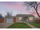 Charming single-story home featuring a well-maintained lawn and detached garage, perfect for first-time homebuyers at 1480 S Osceola St, Denver, CO 80219