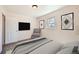 Serene bedroom features neutral tones, providing a calm and inviting space for relaxation at 1480 S Osceola St, Denver, CO 80219