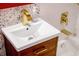 Bathroom vanity features tile accent, wood drawers, waterfall faucet, and a modern sink at 7991 Stuart St, Westminster, CO 80030