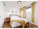 Bright bedroom featuring hardwood floors, a ceiling fan, and natural light at 7991 Stuart St, Westminster, CO 80030