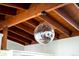 Unique ceiling detail shows wooden beams, a modern light fixture and a hanging disco ball at 7991 Stuart St, Westminster, CO 80030
