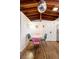 Cozy dining area features a pink table, colorful chairs, hardwood floors, and a striking disco ball at 7991 Stuart St, Westminster, CO 80030