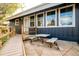 Exterior featuring a ramp and outdoor table and benches with a blue painted home in the background at 7991 Stuart St, Westminster, CO 80030