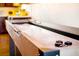 An elegant, modern shuffleboard table in a game room ready for entertainment at 7991 Stuart St, Westminster, CO 80030