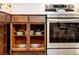 Open kitchen shelving showing neatly organized pots and pans and stainless steel appliances at 7991 Stuart St, Westminster, CO 80030