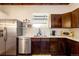 Well-lit kitchen showcasing stainless steel appliances, wooden cabinets, and quartz countertops at 7991 Stuart St, Westminster, CO 80030