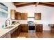 Spacious kitchen features dark wooden cabinets, stainless steel appliances, and sleek countertops at 7991 Stuart St, Westminster, CO 80030