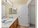 Bathroom featuring double sink vanity and generous lighting at 4747 S Balsam Way # 104, Littleton, CO 80123