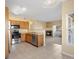 Inviting kitchen flows into the living room that features stainless steel appliances and tile floors at 4747 S Balsam Way # 104, Littleton, CO 80123