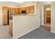 Bright kitchen features wood cabinets and stainless steel appliances for modern convenience at 4747 S Balsam Way # 104, Littleton, CO 80123