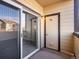 Covered outdoor patio with sliding glass door and storage closet at 4747 S Balsam Way # 104, Littleton, CO 80123