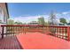 Spacious wooden back deck overlooks the property's green yard and mature trees at 17979 E Oxford Pl, Aurora, CO 80013