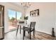 Eat-in kitchen features deck access and modern table and chairs at 17979 E Oxford Pl, Aurora, CO 80013
