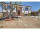 Charming home with a brick and Tudor-style design and a well-maintained yard at 17979 E Oxford Pl, Aurora, CO 80013