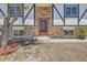 Close up of a brick home showcasing the front door with black and white accents around windows at 17979 E Oxford Pl, Aurora, CO 80013