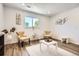 Comfortable sitting room with wood floors, natural light, and modern decor at 17979 E Oxford Pl, Aurora, CO 80013