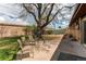 Spacious backyard featuring a patio, privacy fence, and well-maintained lawn with mature trees at 2785 Skyline Dr, Westminster, CO 80030
