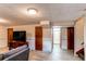 Basement with TV, wood floors, and access to a bathroom at 2785 Skyline Dr, Westminster, CO 80030
