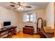 Bright bedroom with hardwood floors, a ceiling fan, and a window providing natural light at 2785 Skyline Dr, Westminster, CO 80030