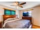 Bedroom featuring wood furniture, a ceiling fan and horizontal blinds at 2785 Skyline Dr, Westminster, CO 80030