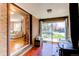 Cozy sun room with brick walls, a wood-burning stove, and access to the backyard at 2785 Skyline Dr, Westminster, CO 80030