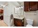 A well-organized bathroom featuring white vanity and decorative mirror at 810 S Vance St # C, Lakewood, CO 80226