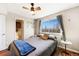 Inviting bedroom with a ceiling fan, natural light, and ensuite bathroom access at 810 S Vance St # C, Lakewood, CO 80226