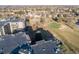 An aerial view showcases the beautiful golf course in this well-maintained and landscaped residential community at 13961 E Marina Dr # 409, Aurora, CO 80014