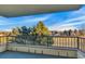 Balcony featuring a view of the neighborhood and community with metal guardrail at 13961 E Marina Dr # 409, Aurora, CO 80014