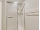Shower stall with modern glass door and white tiled walls at 13961 E Marina Dr # 409, Aurora, CO 80014