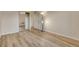 Bright bedroom featuring wood-look flooring and a closet with sliding mirror doors at 13961 E Marina Dr # 409, Aurora, CO 80014