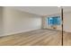 Bedroom featuring wood floors, neutral walls, and a large window at 13961 E Marina Dr # 409, Aurora, CO 80014